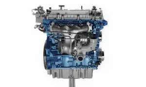 Silnik 1.9 TDI z niebieskim blokiem i turbosprężarką.