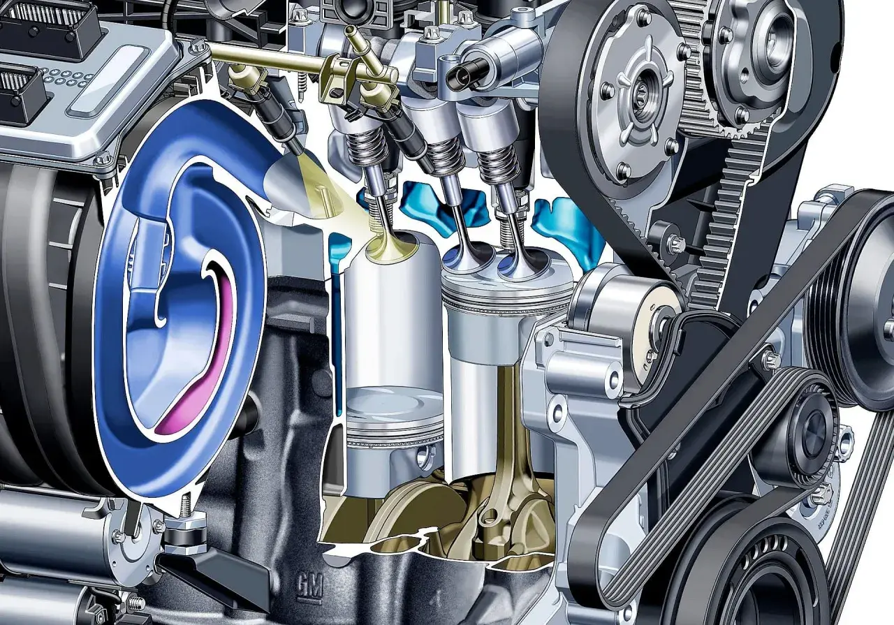 Przekrój silnika z widocznymi tłokami, zaworami i układem rozrządu. Ilustracja pokazuje mechanizm, który może zapobiegać nieprawidłowemu spalaniu stukowemu.