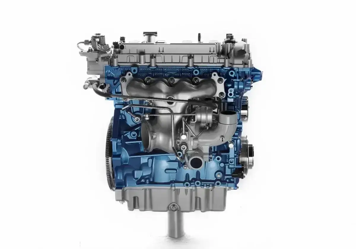 Silnik 1.9 TDI z niebieskim blokiem i turbosprężarką.