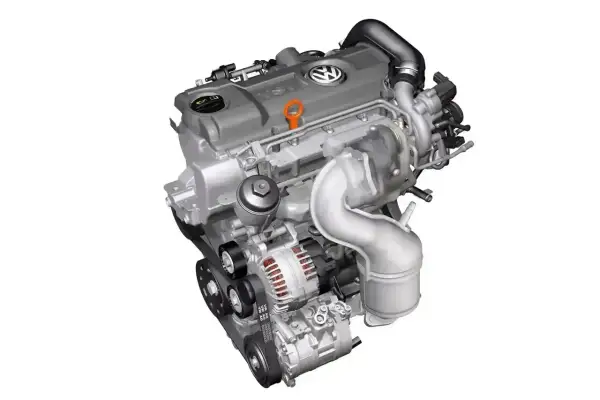 Silnik Volkswagen TDI z turbosprężarką i alternatorem, gotowy do pracy.